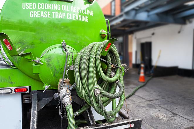 a grease trap being pumped out by a professional service in Xenia